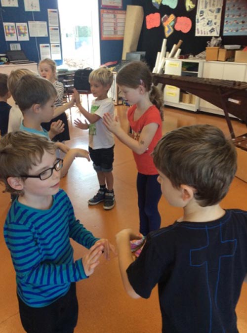 Kids performing in music class